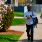 Two students walking on south campus in the spring. 